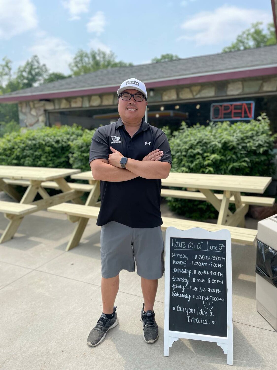 Yang Hang stands outside Hang’s Chinese Restaurant in Harrison, the restaurant he grew up working in and now co-owns with his brother Blon and longtime manager Kellie Griffith.